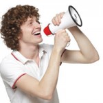 A young man with a megaphone