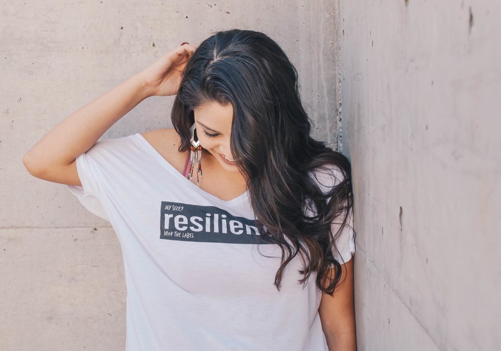 Woman with t-shirt and resilient logo