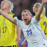 female footballer celebrates goal