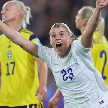 female footballer celebrates goal