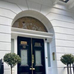 Large, black front door for 10 Harley Street, London